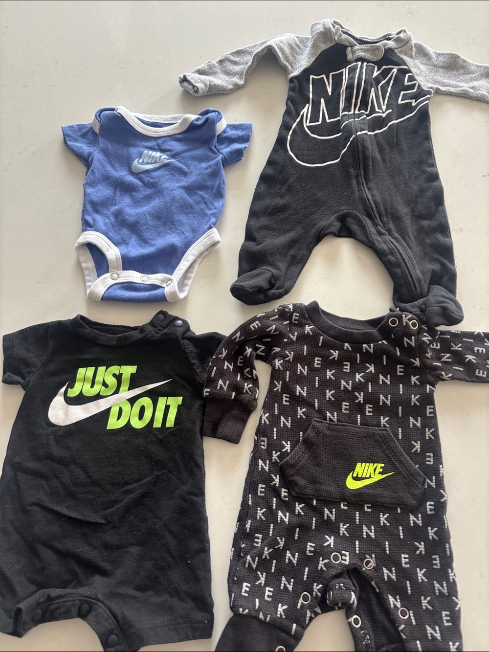 Nike Baby One-Pieces in Black, Blue, and Gray